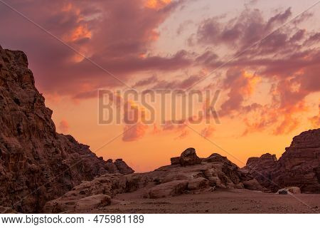 Sunset Colorful Orange Sky Landscape With Sandstone Rocks In Little Petra Archaeological Site, Jorda