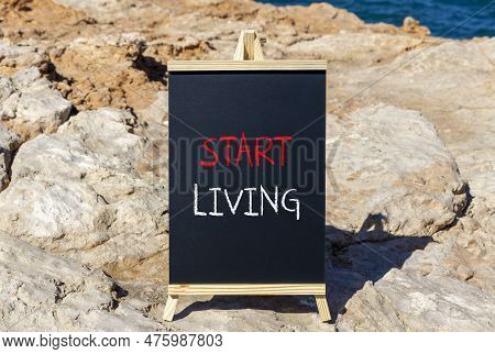 Start Living Symbol. Concept Words Start Living On Beautiful Black Chalk Blackboard On A Beautiful S