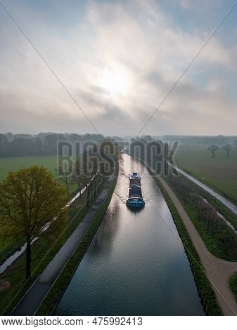 Aerial View Of A Colorful Dramatic Sunrise Sky Over A Canal With A Draw Bridge In Belgium. Canals Wi