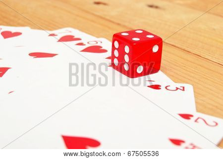 Poker cards and red dice