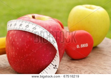 Apples, dumbbells and tape measure