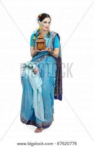 Artist Holding Her Made House Of Spirits