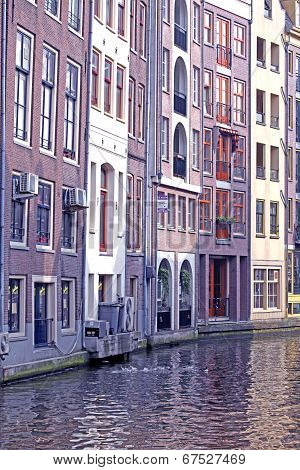 Water canal and typical architecture in city Amsterdam