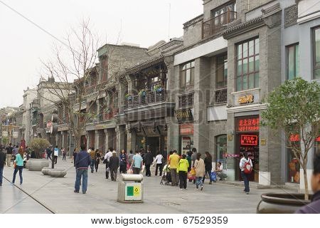 BEIJING - APRIL 27: Tourists and shoppers line Qianmen Street on April 27, 2013 in Beijing, China. Qianmen Street is a famous tourists place in Beijing