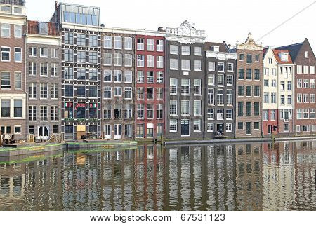 Water canal and typical architecture in city Amsterdam