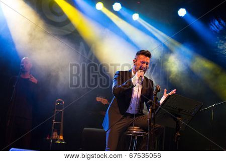 LOULE - JUNE 26: Ala dos Namorados, traditional band from Portugal, performs on stage at festival med, a world music festival, in Loule, Portugal, June 26, 2014 