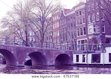 Water canal and typical architecture in city Amsterdam