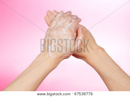 Woman's hands in soapsuds