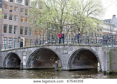 Water Canal And Typical Architecture In Amsterdam, Netherlands