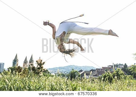 Capoeira woman awesome stunts in the outdoors