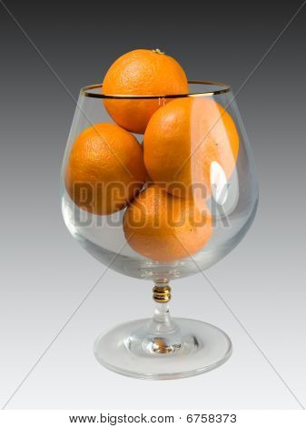 Mandarinen in einem Glas.