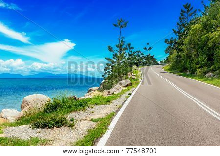 Curving Road Along Sea In Magnetic Island, Australia