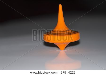 Orange spinning top