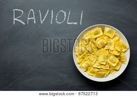 cooked ravioli pasta on chalkboard