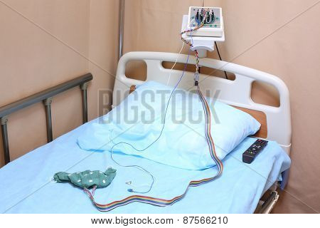 Head of the bed with a pillow and electroencephalograph in a hospital ward