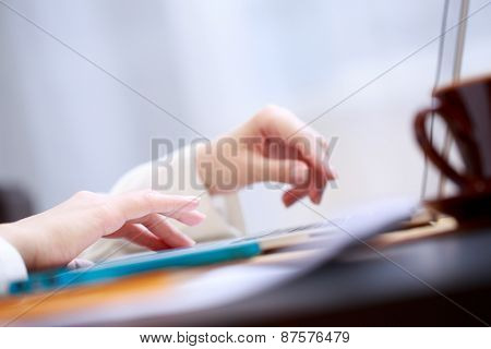 Close-up shot touching laptop trackpad. 