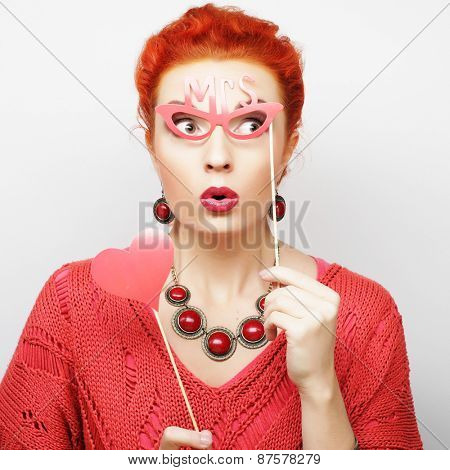 Attractive playful young woman ready for party - falce lips and glasses  