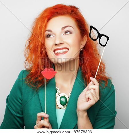 Attractive playful young woman ready for party - falce lips and glasses  