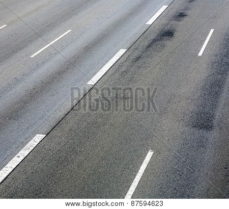 Pattern Of Empty Highway In Grea With Median Stripes