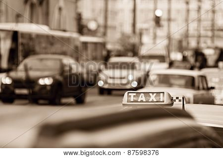 Taxi On City Streets In Tone Sepia