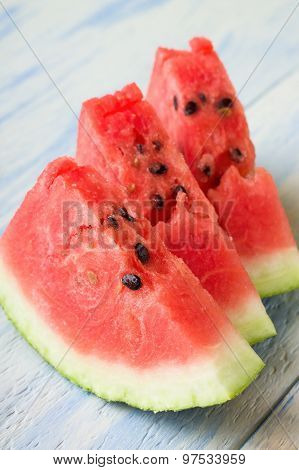 Three Fresh Slices Of Red Melon