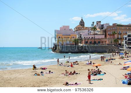 Sitges, Spain - May 23: The Tourists Enjoiying Their Vacation On The Beach On May 23, 2015 In Sitges