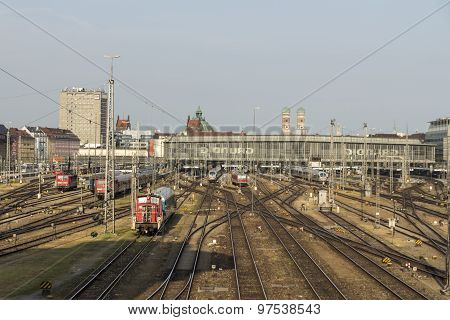MUNICH, GERMANY - JULY 3, 2015: Central railway station in Munich with arriving / leaving trains and a lot of rail tracks picture was taken from the Hackerbruecke
