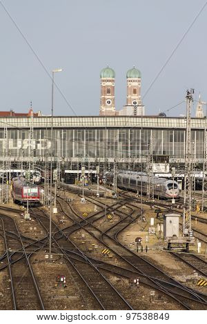 MUNICH, GERMANY - JULY 3, 2015: Central railway station in Munich with arriving / leaving trains and a lot of rail tracks picture was taken from the Hackerbruecke