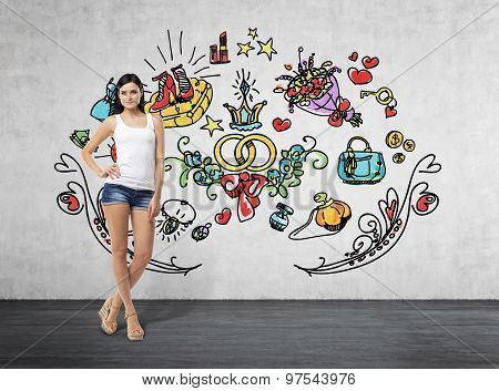 Full Length Portrait Of A Brunette Woman Who Is In A White Tank Top And Blue Denim Shorts. She Is Dr