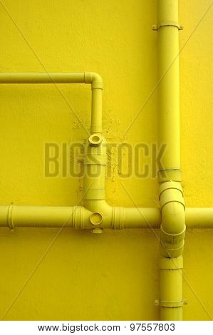Yellow Building Wall and Pipes