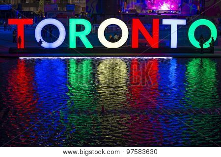 TORONTO,CANADA-JULY 9,2015: The new Toronto sign in Nathan Phillips Square celebrating the PanAm games, a stage have been mounted to held a constant party called Panamania