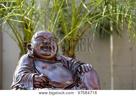 Happy Buddha In Garden Patio