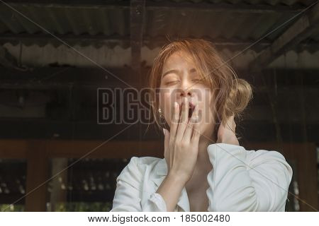 Portrait of sleepy woman looking very bored and tired