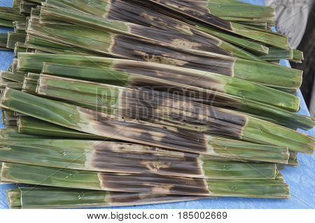 Kanom Jark Thai sweetmeat made of flour coconut and sugar with nipa plam leaves
