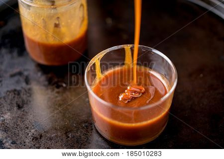 This sweet and delicious caramel sauce can be used as topping to add flavor to cakes ice cream and many other desserts.