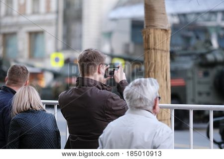 Moscow, Russia - May, 3, 2017: People photograph military parade repetition on Tverskaya street in a center of Moscow