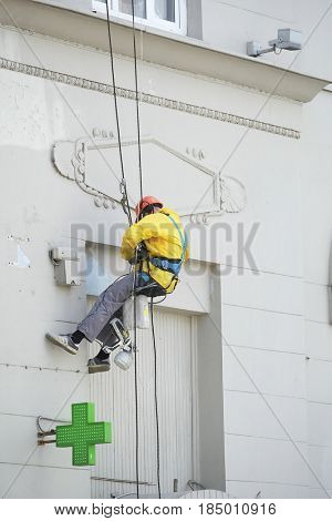 Moscow, Russia - May, 5, 2017: steeplejack works in a center of Moscow