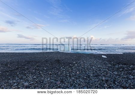 Black rock and sand beach coastline winter season landscape background Iceland