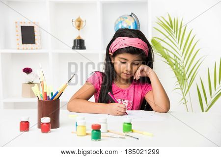 indian girl drawing, indian girl painting,asian girl colouring or drawing with sketch pen, indian girl and art and craft
