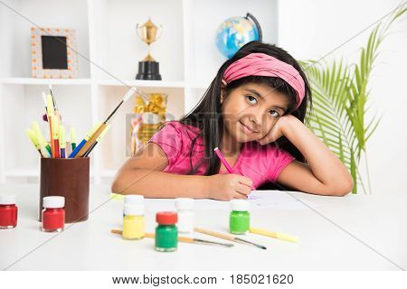indian girl drawing, indian girl painting,asian girl colouring or drawing with sketch pen, indian girl and art and craft