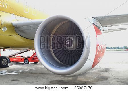 BANGKOK, THAILAND - 30 APRIL 2017: Closeup view of Air Asia engine plane. Air Asia is one of the best airlines that offer cheap flight than Malindo Air
