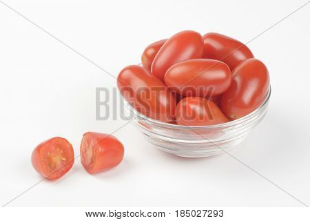 Tomate cherry pera on a bowl on white background