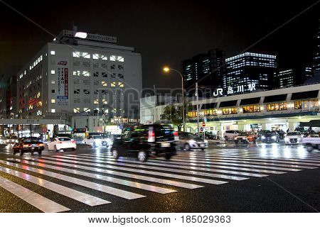JAPAN, TOKYO, APRIL, 02, 2017 - Night traffic on the streets of Tokyo near Shinagawa Station  Shinagawa-eki is a major railway station in Tokyo, Japan.