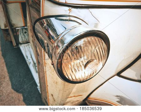 Headlights of  Tuk Tuk or sam-lor meaning three-wheeler . Tuk Tuk is one of the public transport in Thailand.