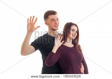 smiling young guy with a girl holding hands at the top with the Palms is isolated on a white background