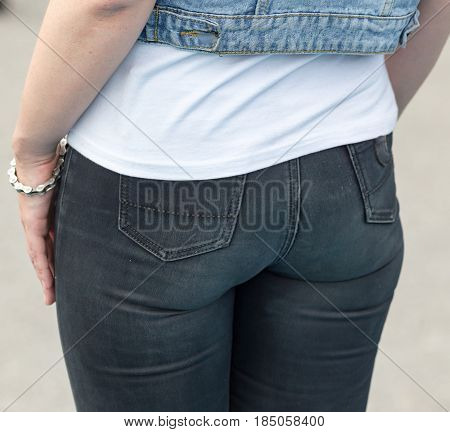 Beautiful ass girl in jeans in the park
