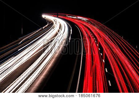 Highway at night with blurred car lights in a long exposure shot