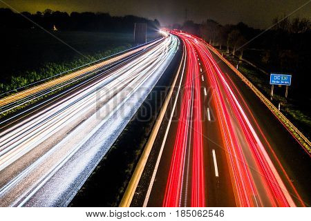Highway at night with blurred car lights in a long exposure shot