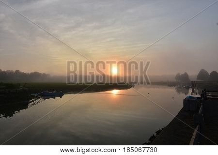 Sun rising on a foggy morning in Duxbury Massachusetts.
