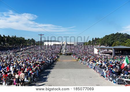 Fatima Portugal - May 13 2014: Crowd of people at the Sanctuary of Fatima during the celebrations of the apparition of the Virgin Mary in Fatima Portugal.